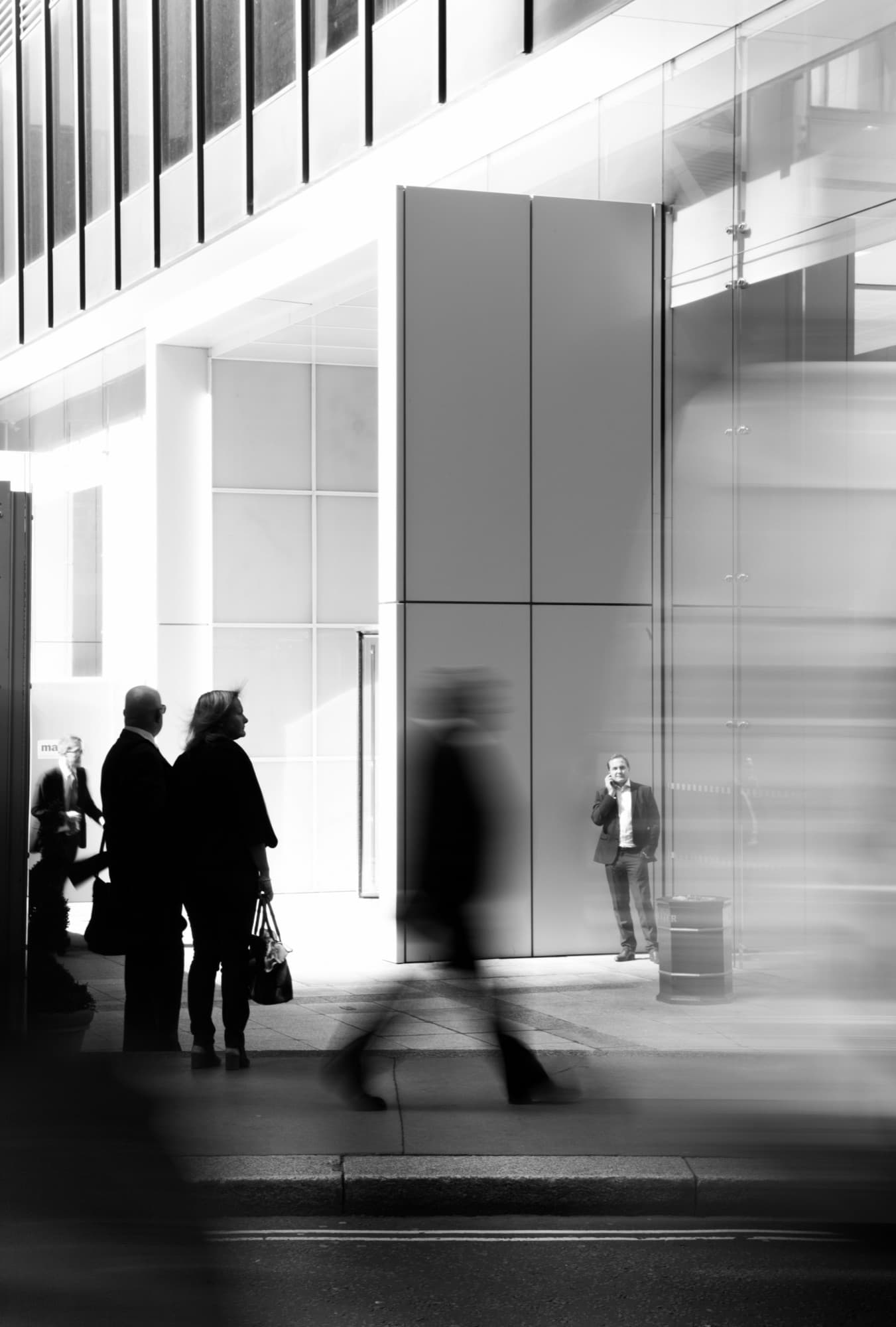 Professionals outside a corporate building